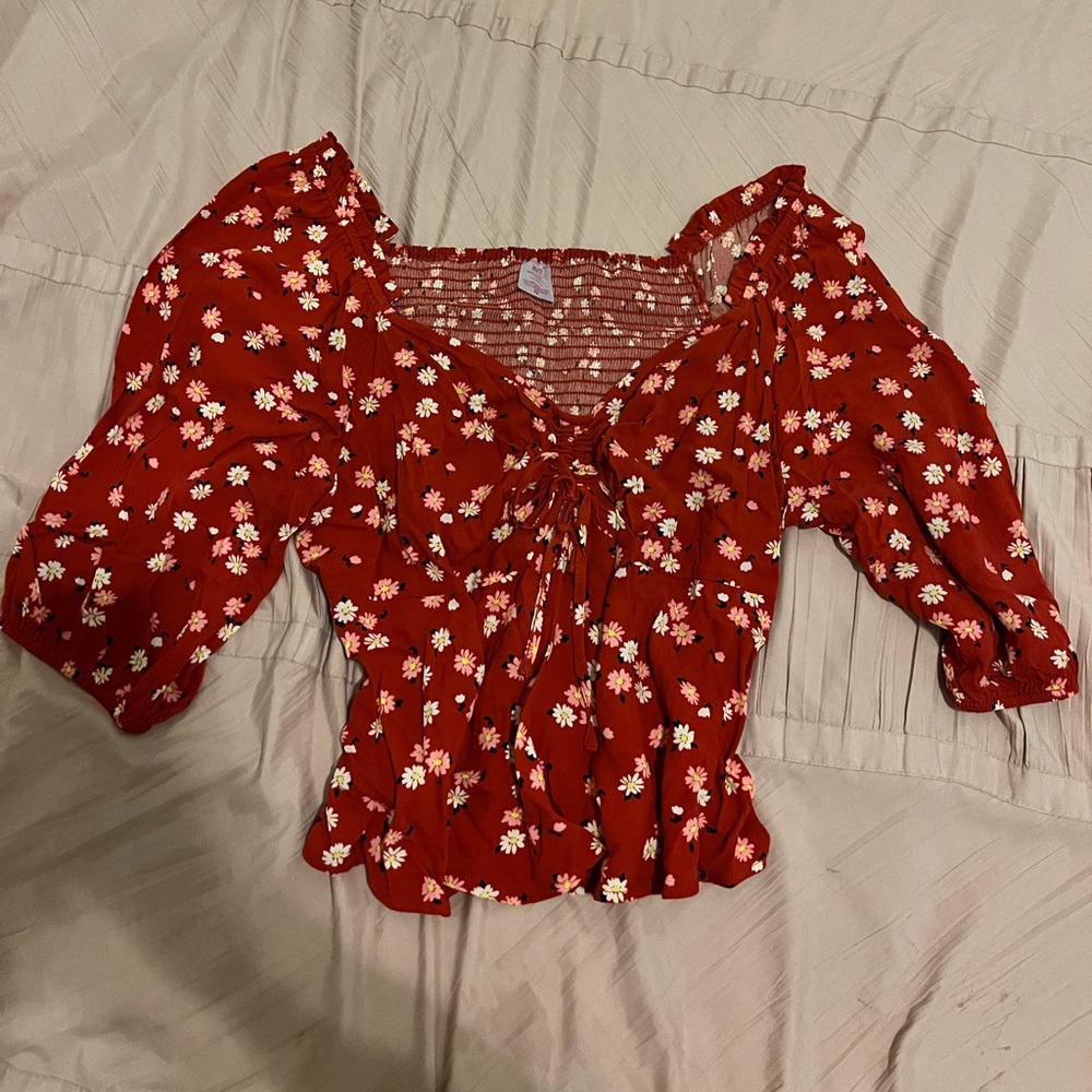 Red floral blouse